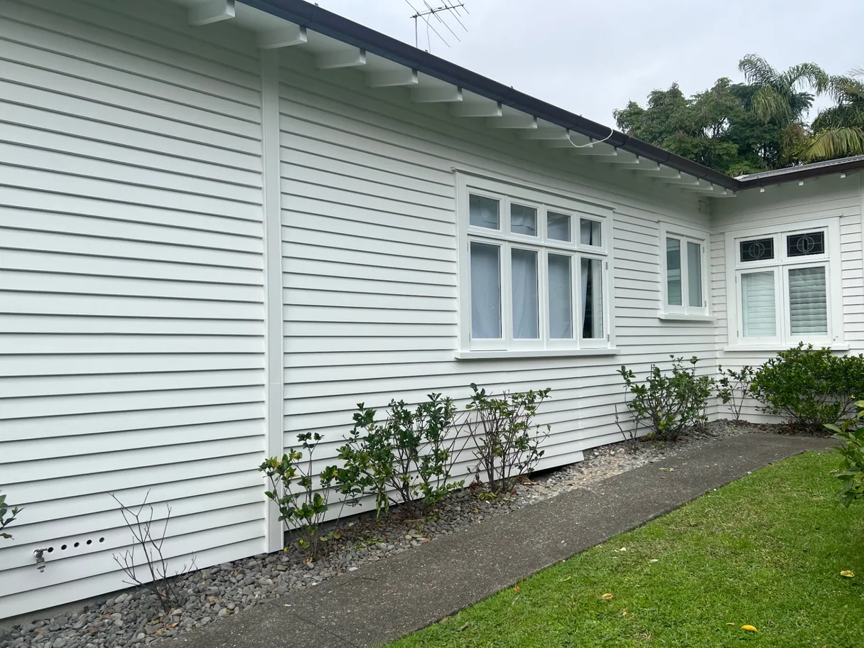 Freshly repainted white weatherboard New Zealand home